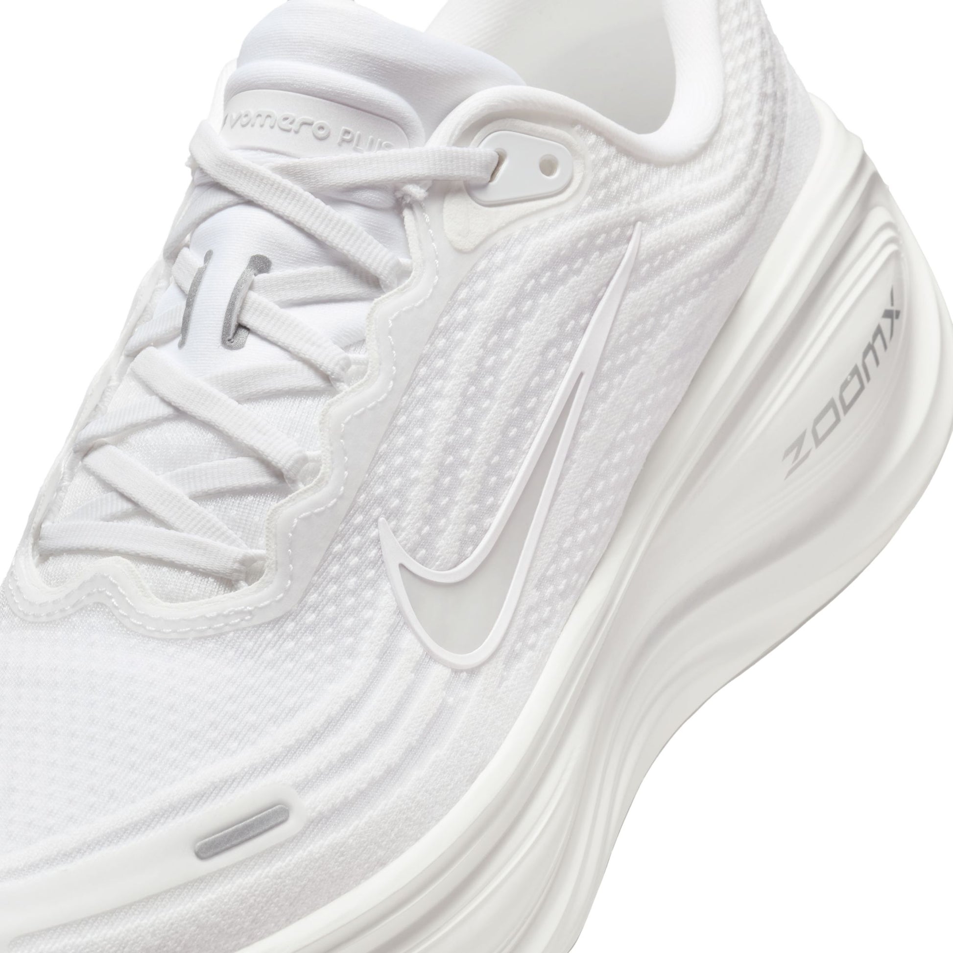 White running shoe with 'ZoomX' branding on a white background