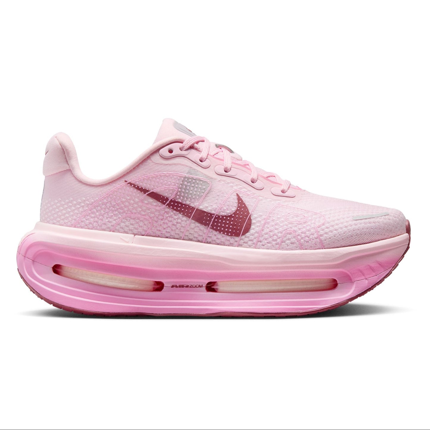 Pink Nike running shoe on a white background