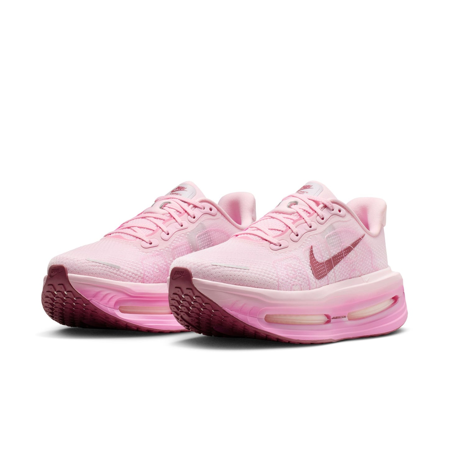 Pink running shoes with Nike logo on a white background