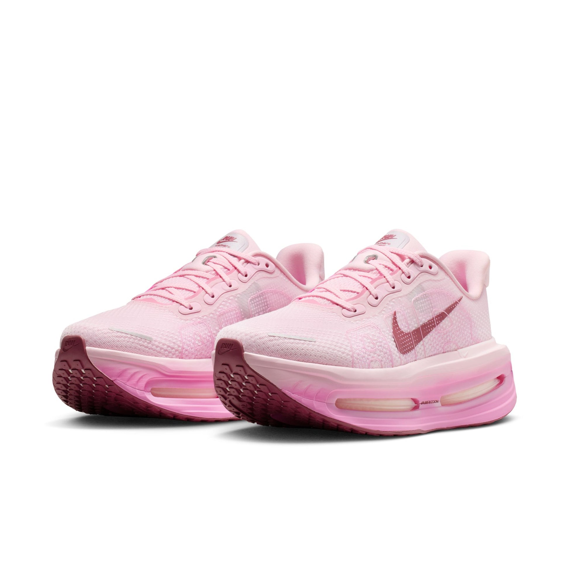 Pink running shoes with Nike logo on a white background