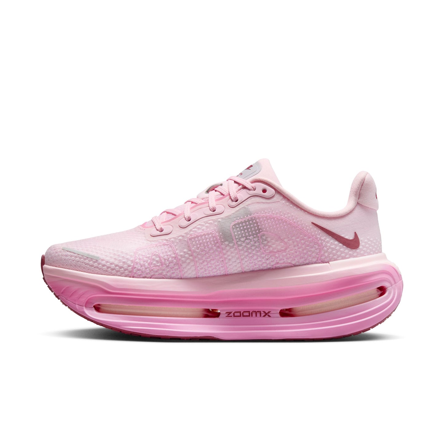 Pink running shoe with 'zoomx' on a white background