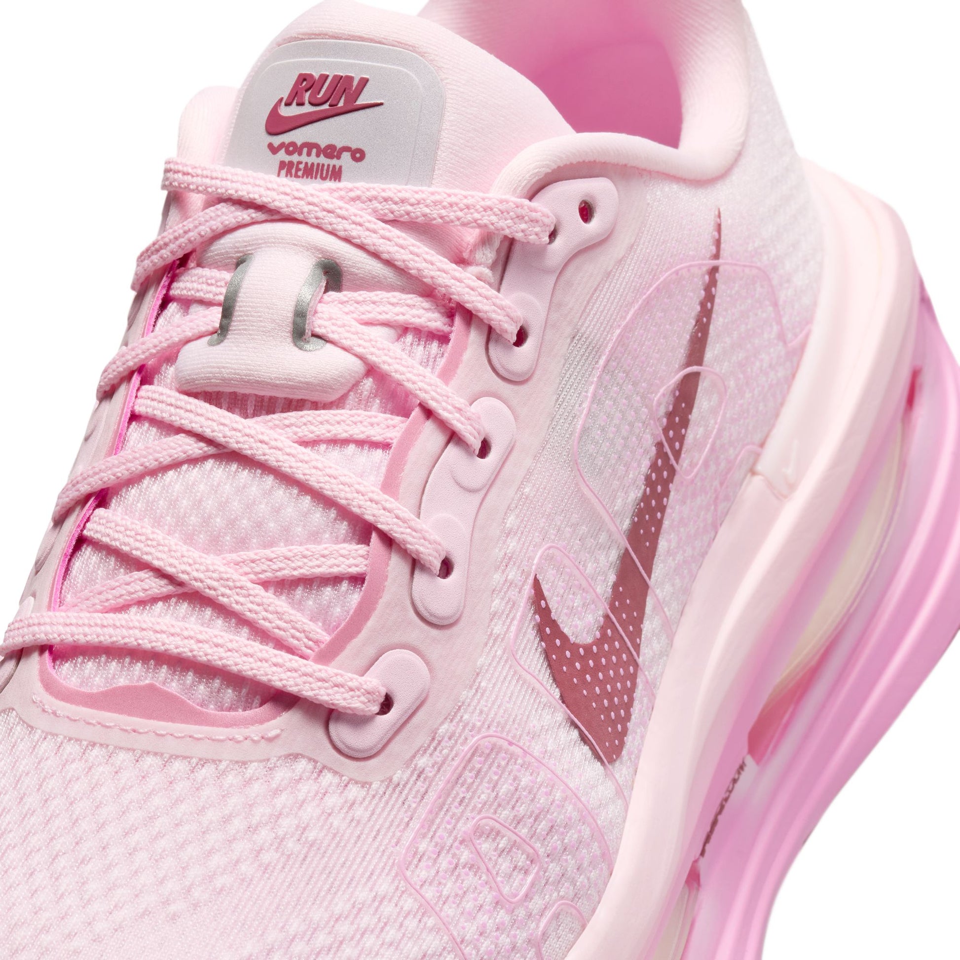 Pink running shoe with visible Nike logo on a white background