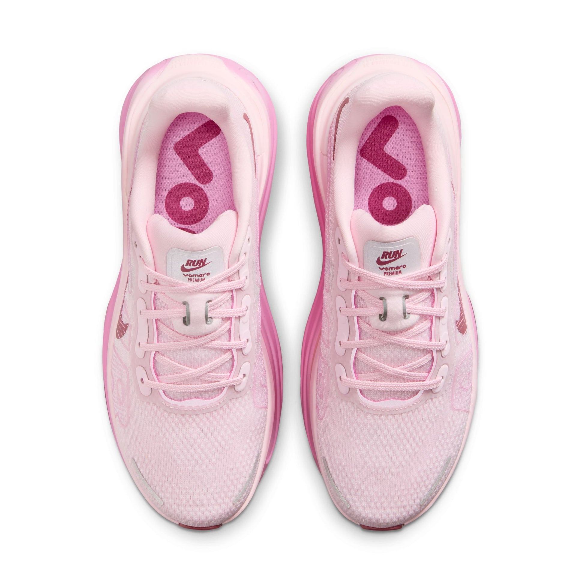 Pink running shoes with visible brand logo on a white background