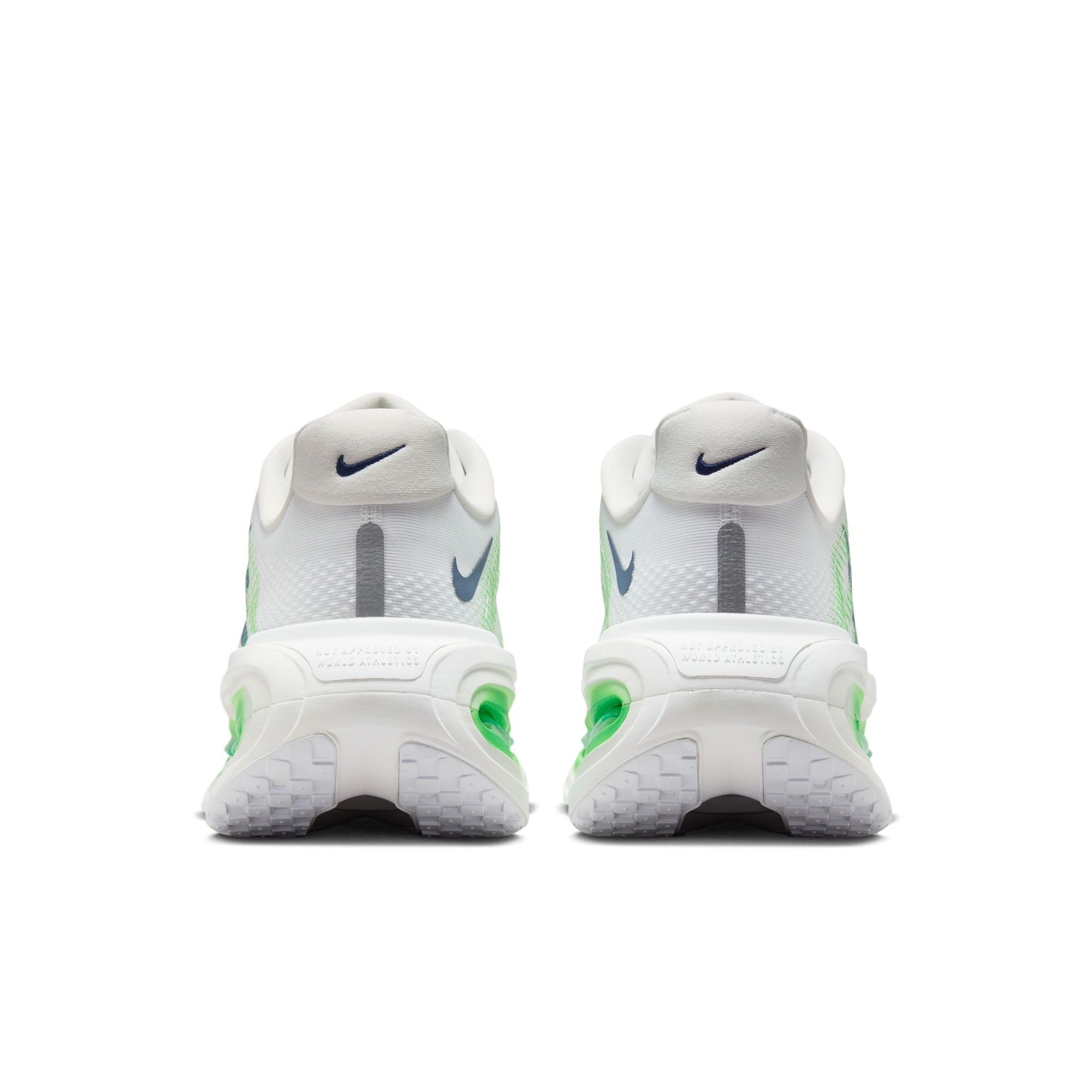 A pair of Nike running shoes shown from the back, featuring a white mesh upper with gray and neon green accents, and a chunky white sole.