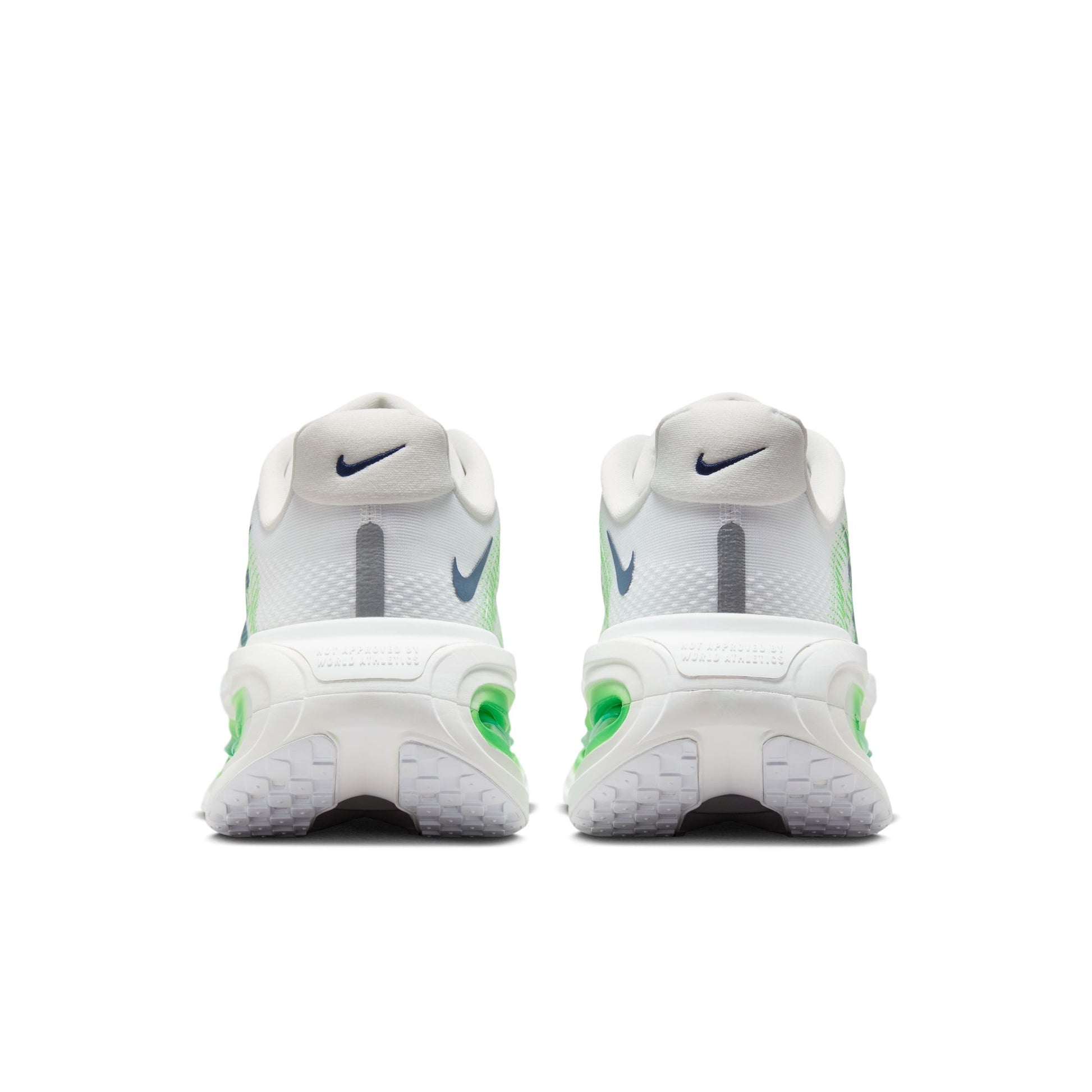 A pair of Nike running shoes shown from the back, featuring a white mesh upper with gray and neon green accents, and a chunky white sole.