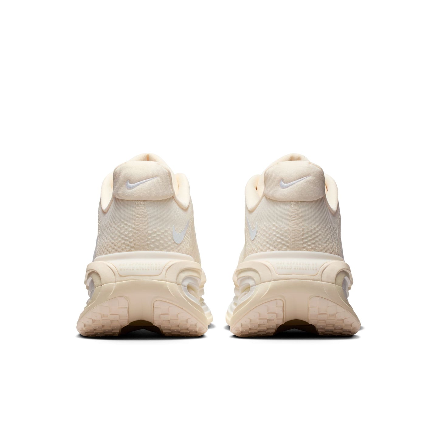 Beige sneakers with Nike logo on a white background