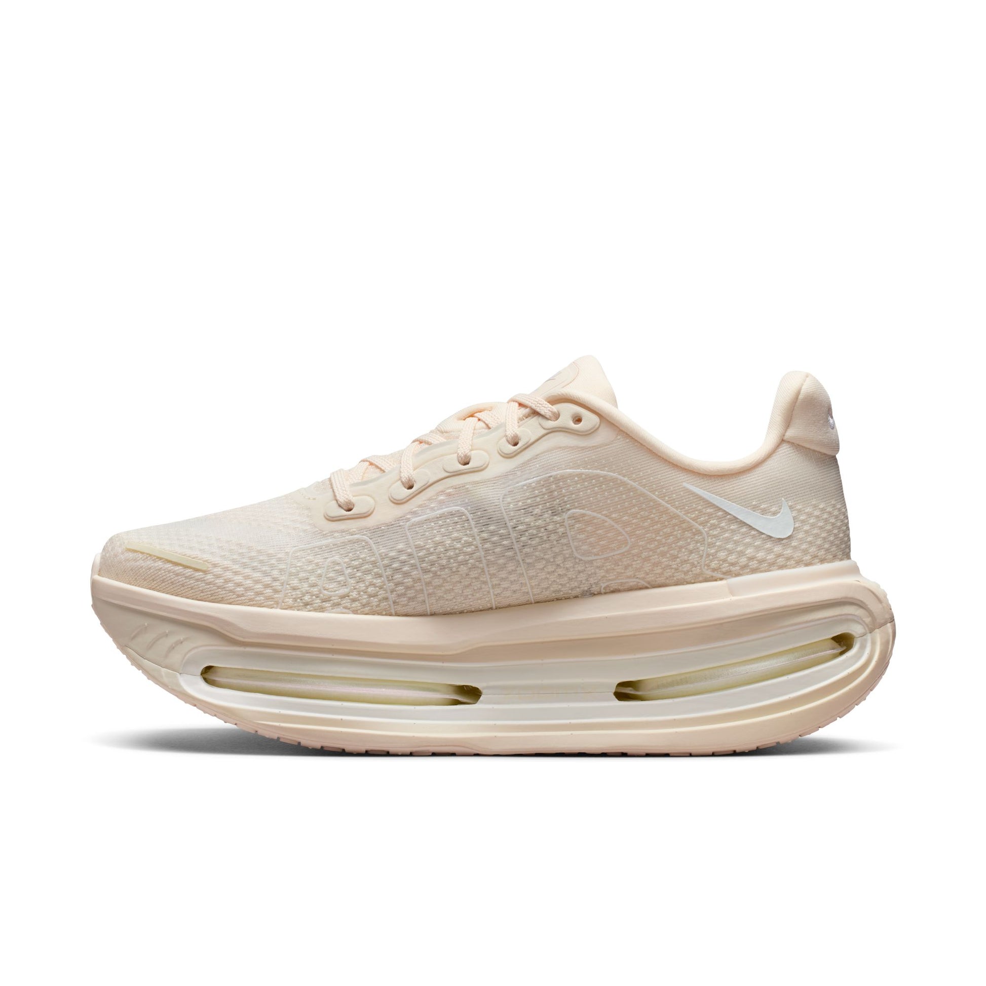 Beige running shoe with a white sole on a white background