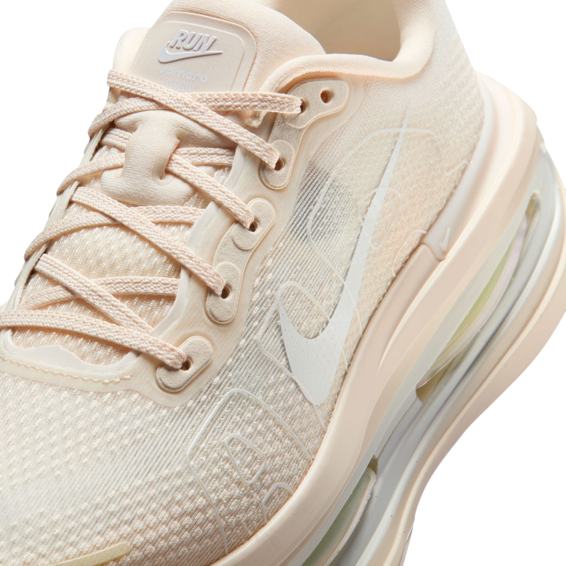 Beige sneaker with visible Nike logo on a white background