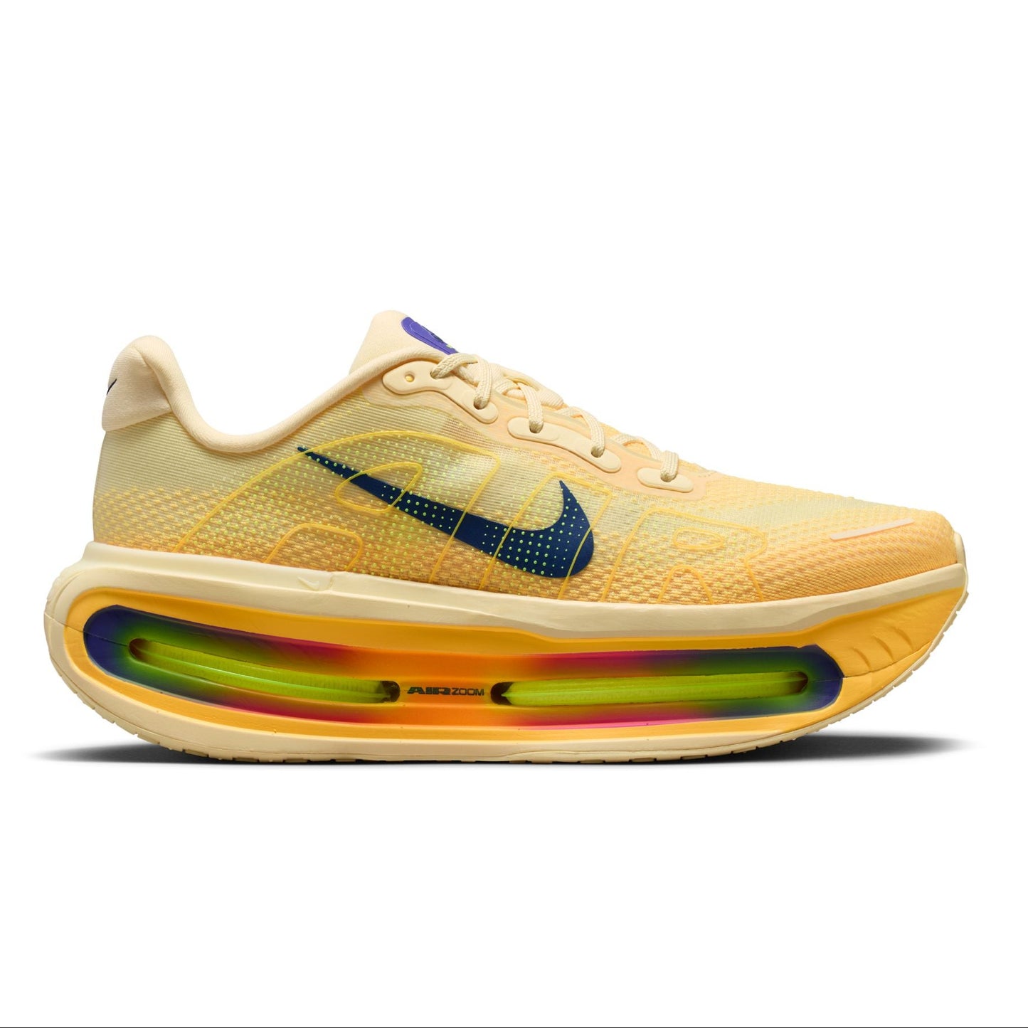Yellow sneaker with a colorful sole on a white background