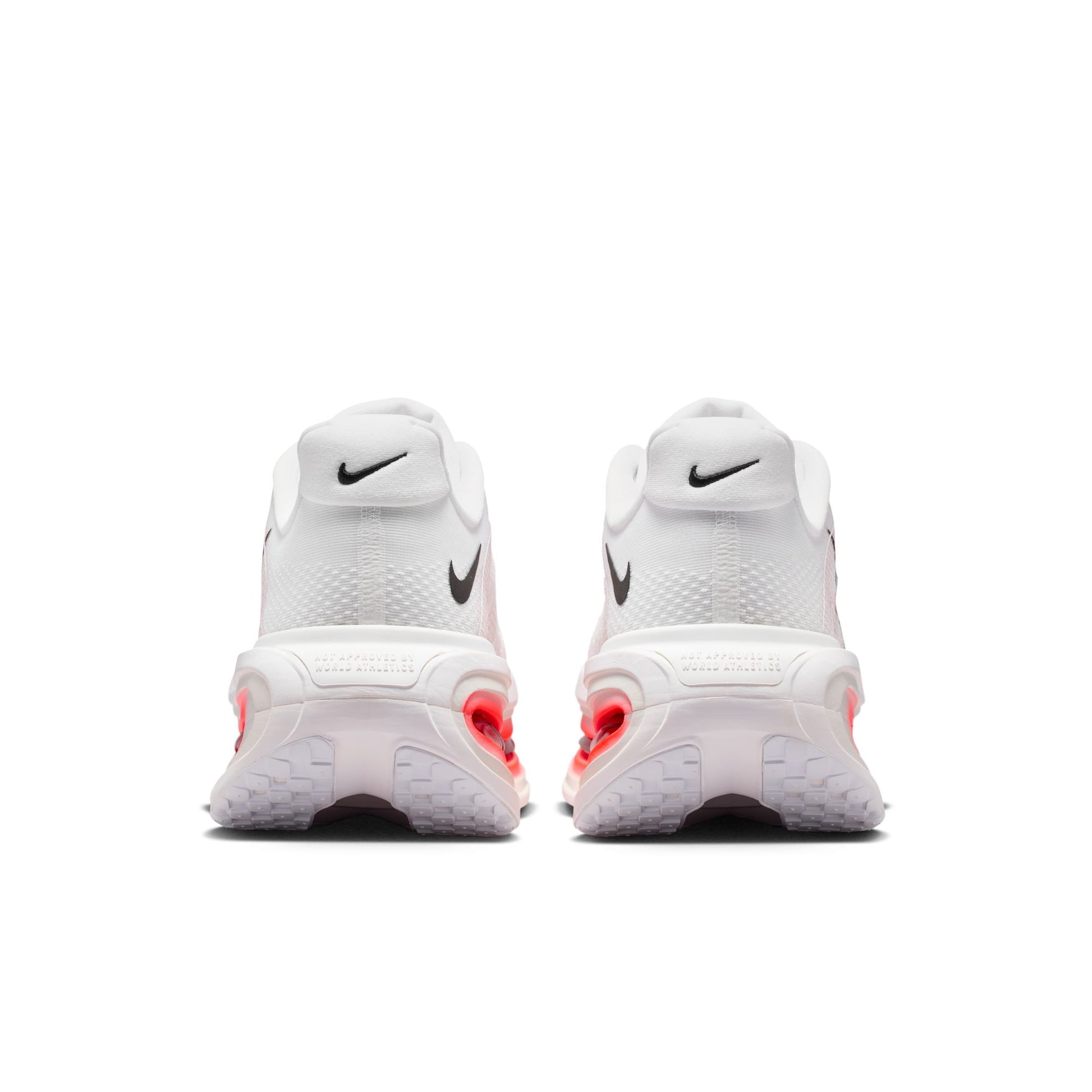 White sneakers with red accents on a white background