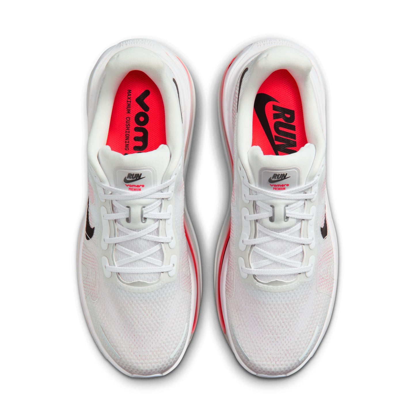 White running shoes with red interior and visible Nike logo on a white background