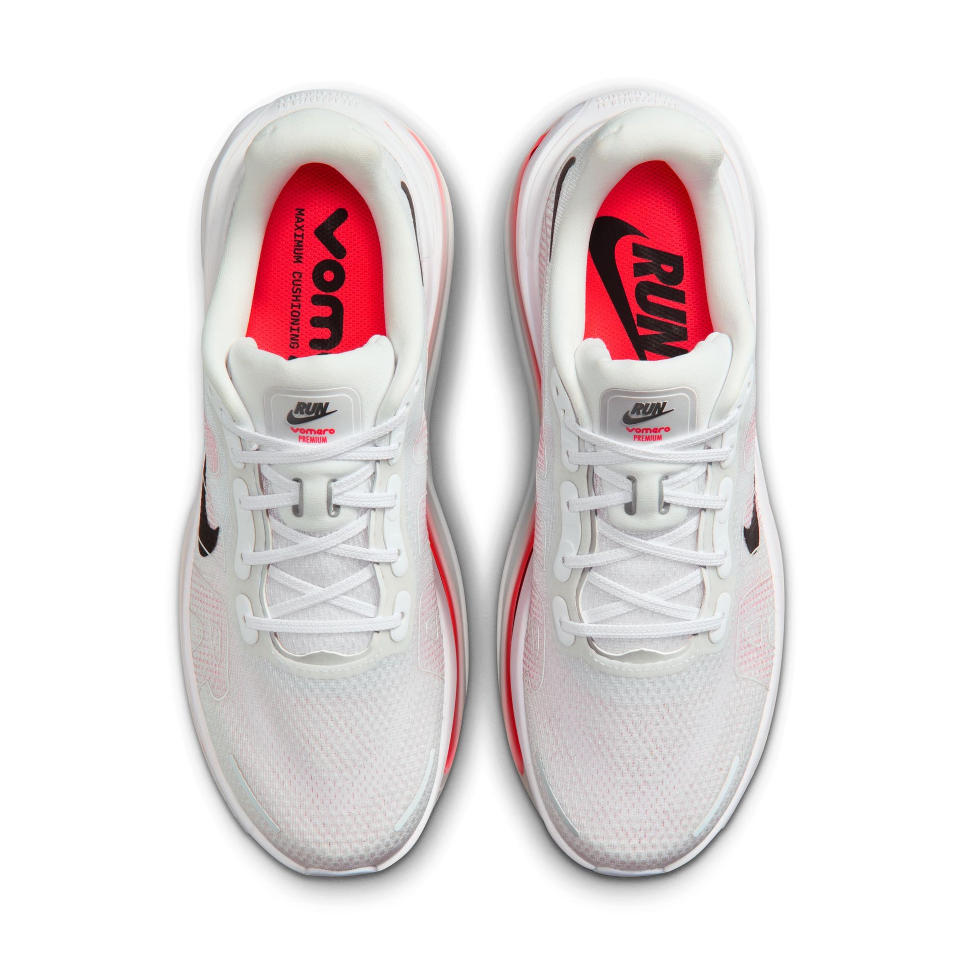 White running shoes with red interior and visible Nike logo on a white background