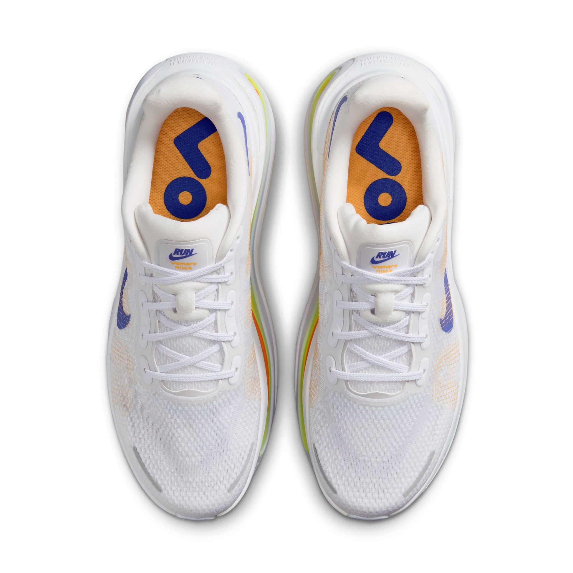 White shoe with blue, yellow orange accents on white background