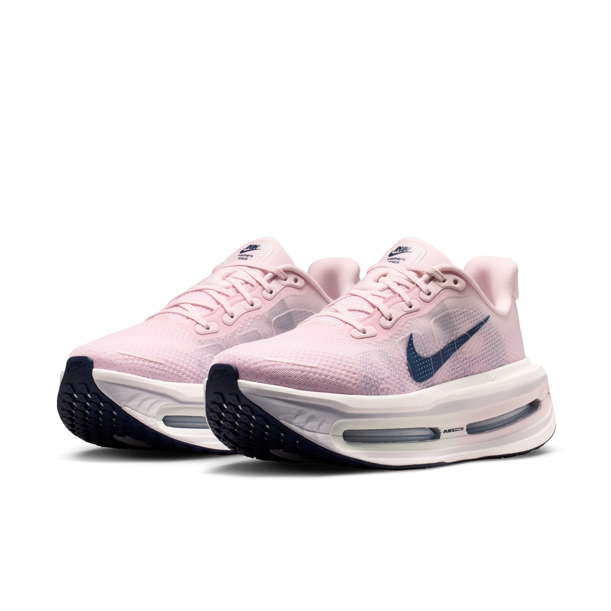 Pink shoes with blue accents on white background