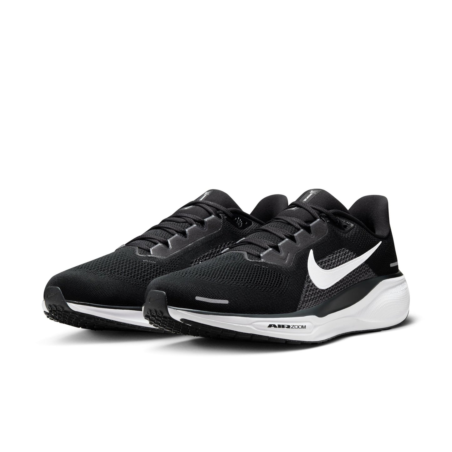 Black running shoes with white sole on a white background