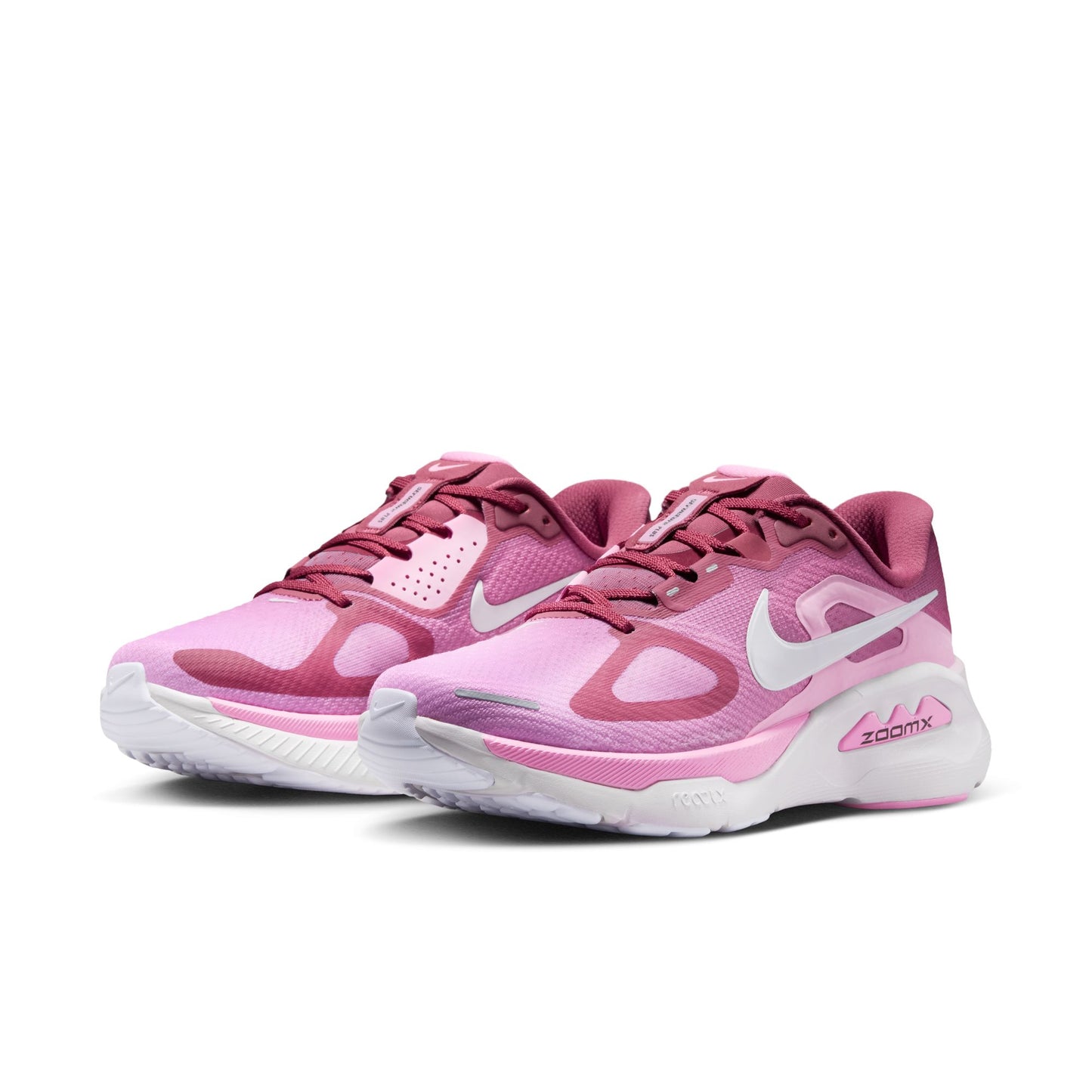 Pink running shoes with white accents on a white background