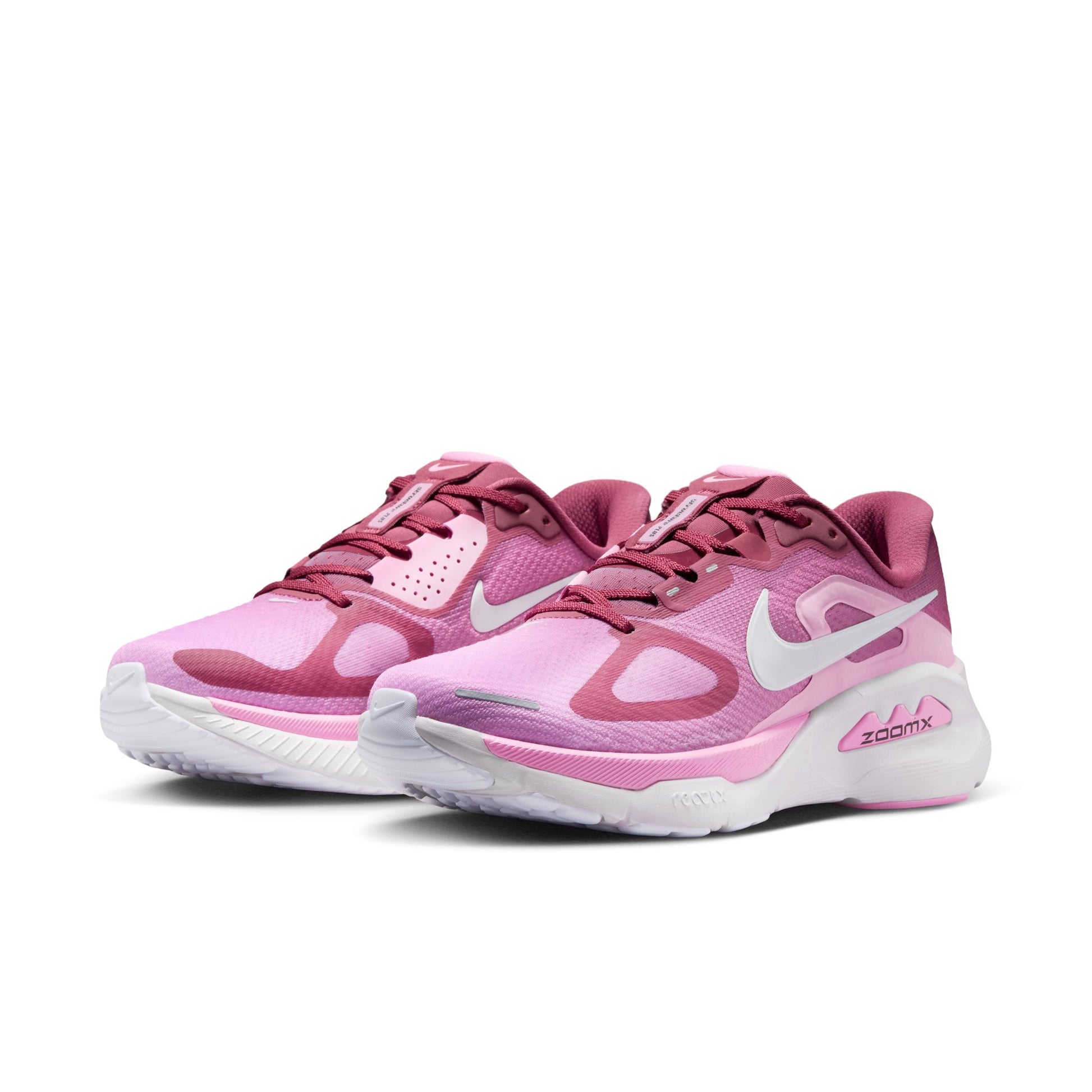 Pink running shoes with white accents on a white background