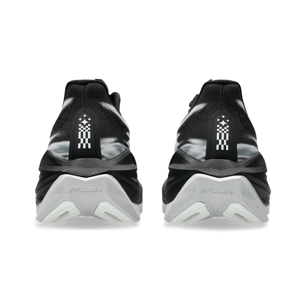 Black and white athletic shoes with a brand logo on the back on a white background
